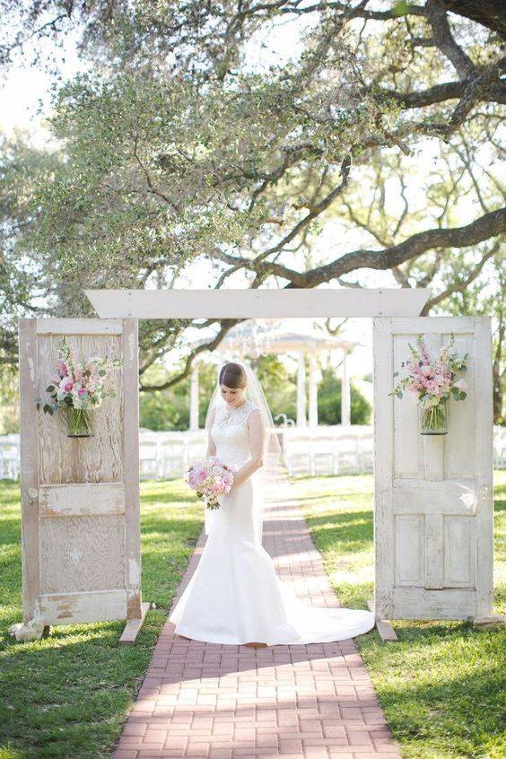 All White Wedding, Rustic Wodden Doors With Pink Flowers // 10 Rustic Old Door Wedding Decor Ideas For Outdoor Country Weddings