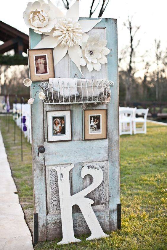 Blue Vintage Wedding Door With Photo Frames & White Flowers // 10 Rustic Old Door Wedding Decor Ideas For Outdoor Country Weddings
